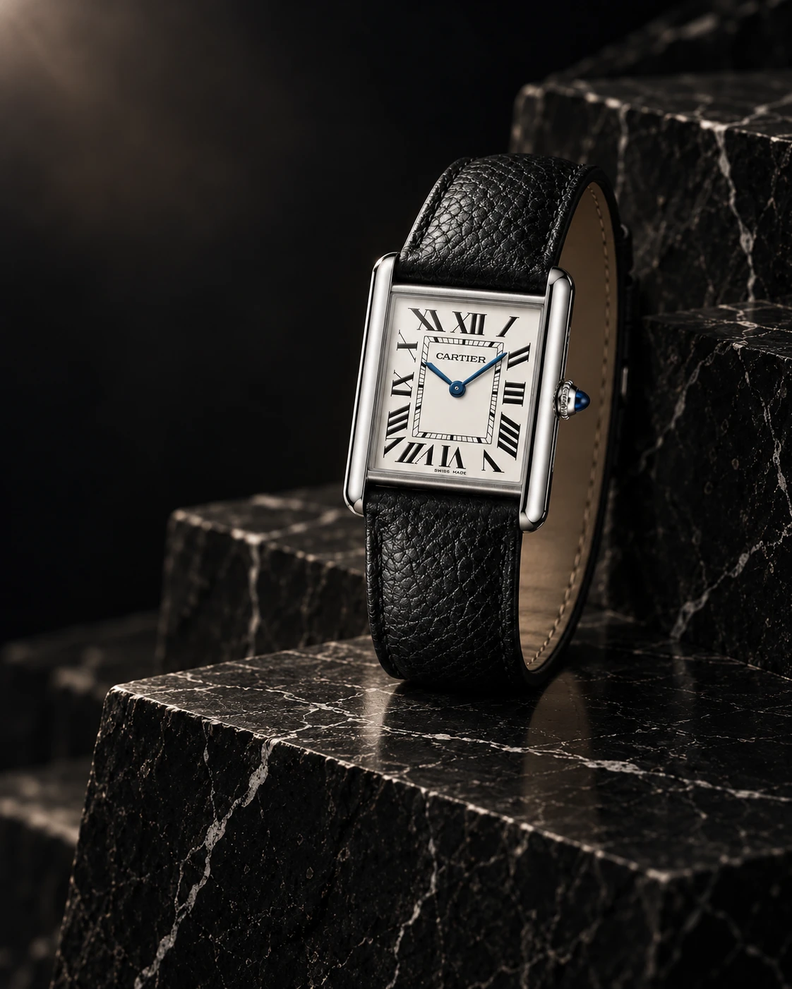 Cartier Tank Must on white-veined Nero Marquina black marble, an AI-generated editorial composition